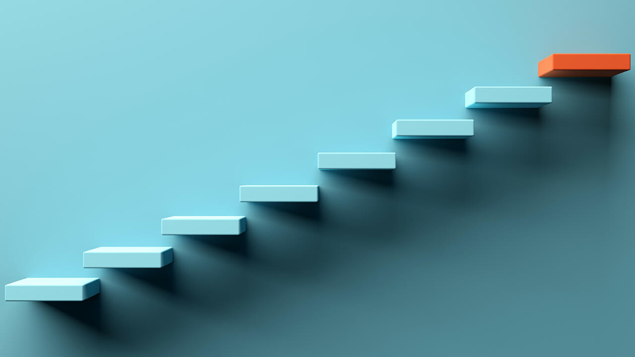 Blue stairs leading to a top orange step