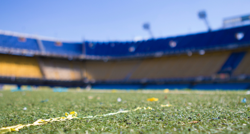 Closeup of a field surrounded by stadium seating